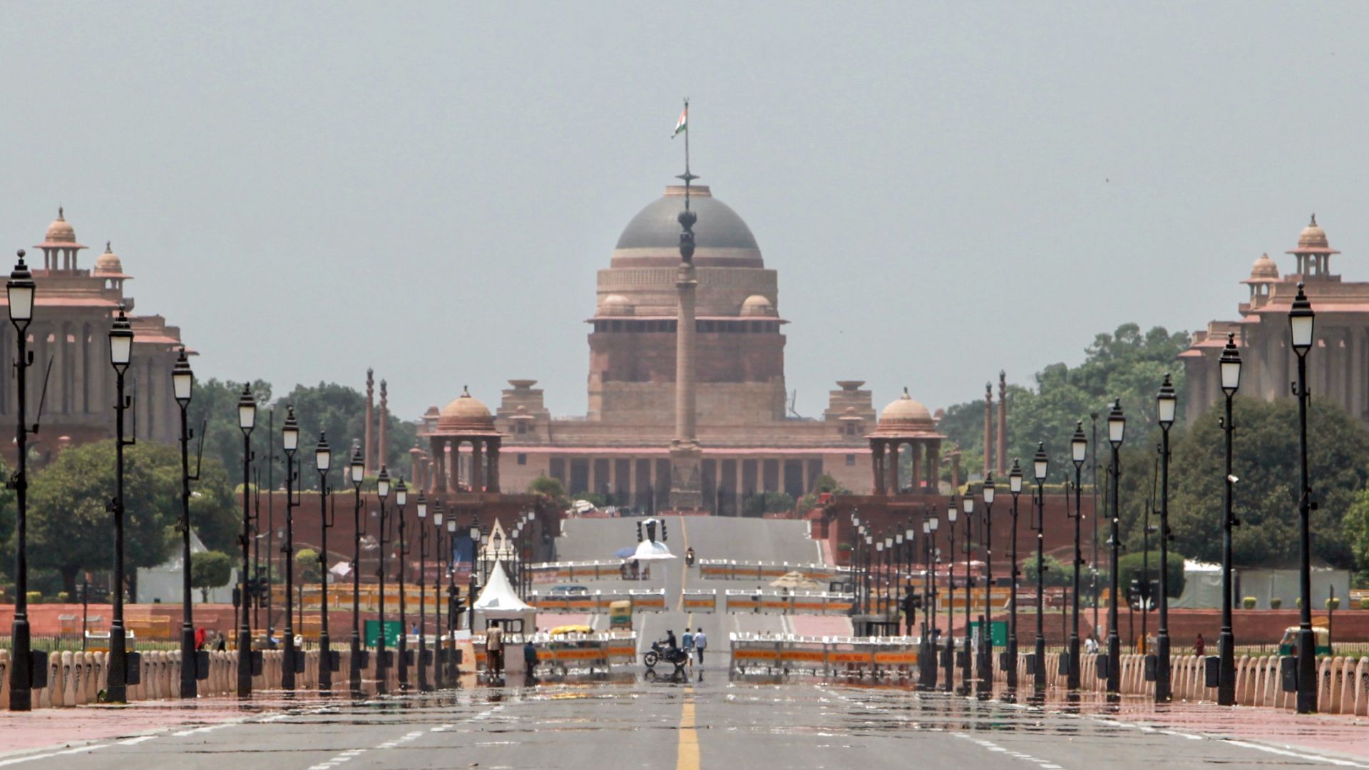 A heat-induced mirage shimmers along the road leading to Rashtrapati Bhavan